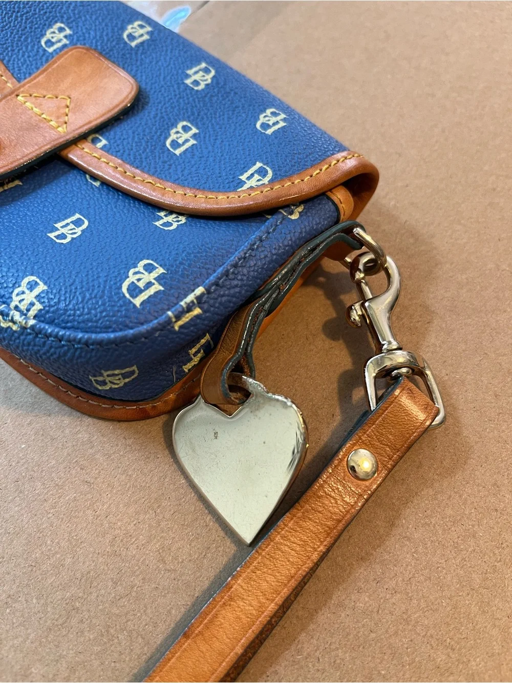 Dooney & Bourke Blue Signature Mini Wristlet with Tan Trim